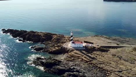 Scenic-View-Of-Favaritx-Lighthouse-On-The-Spanish-Island-Of-Menorca,-Spain---aerial-drone-shot