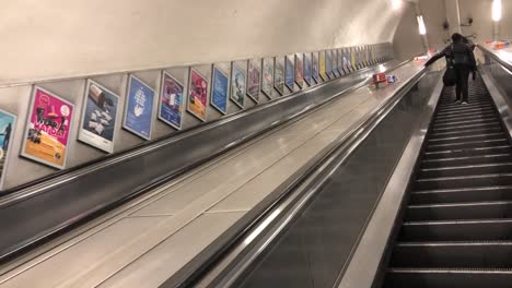 Escalator-leaving-the-tube-station-in-central-London,-UK