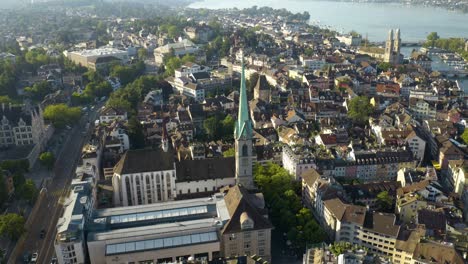 Orbiting-Shot-Above-Predigerkirche-Church---Zurich's-Famous-Old-Town-in-Background