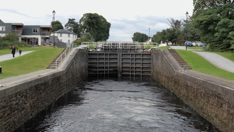 Grey-metal-gate-locks-at-the-Caledonian-Water-Canal-in-Fort-William,-Scotland,-UK