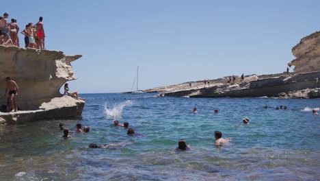 Crowd-having-fun-and-relaxing-at-rocky-bay-of-St