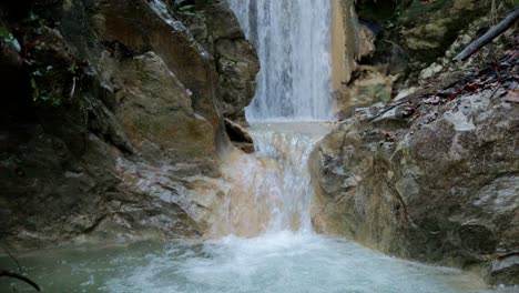 mountain-stream,-waterfall-revealing-shot-from-bottom