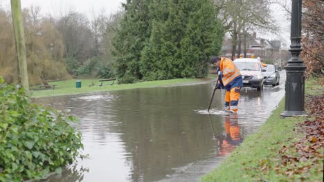 Municipality-Workers-Draining-a-Flooded-Street-next-to-The-City-Park-in-Brussels,-Belgium