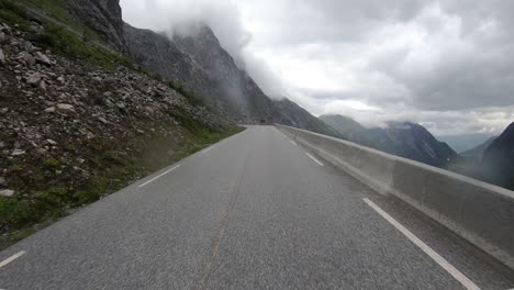 Driving-In-A-Car-Up-Steep-Mountain-Road-In-Norway-With-POV-Through-Windshield---timelapse