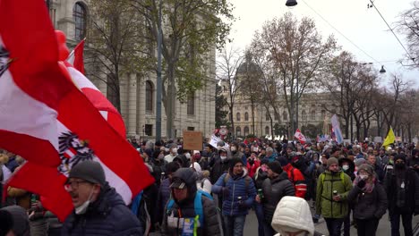 Far-right-members-walking-through-the-streets-during-anti-corona-protests-in-Vienna,-Austria