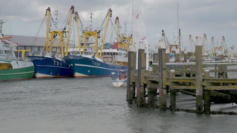 A-Sailboat-enters-under-sail-the-harbour-of-texel