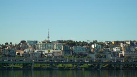 Namsan-Tower-over-Yongsan-district-from-Han-river,-iconic-landmark-of-Seoul-South-Korea,-also-known-as-N-Seoul-Tower,-YTN-Seoul-Tower-or-Seoul-Tower