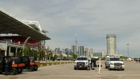 Surveillance-Police-Drone-Lands-as-part-of-Security-Measures-for-Military-Funeral,-Toronto,-Canada