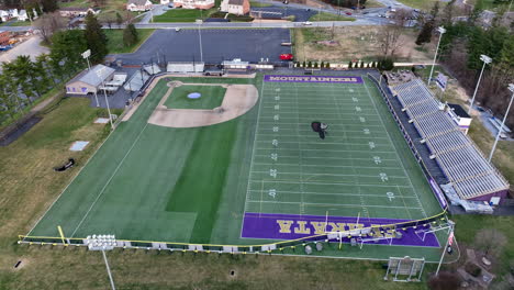 Athletic-football-soccer-baseball-field-at-American-school-Winter-aerial-view