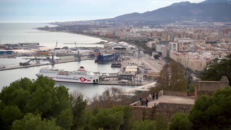 Big-cruise-ship-parked-in-harbor-of-Malaga,-Spain