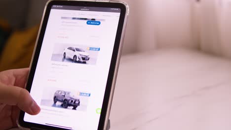 Browsing-an-online-marketplace-for-used-cars-on-the-Cars24-website