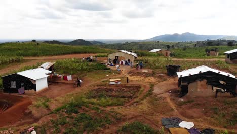 Group-of-Field-Workers-in-Africa,-Washing-Face-and-Hands,-Drone-View