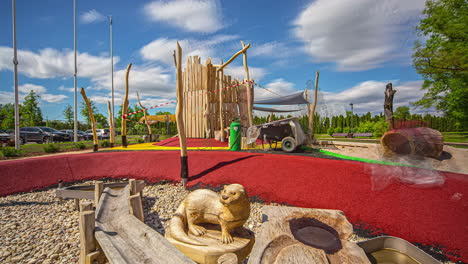 Static-shot-of-construction-workers-busy-coloring-the-ground-for-kids-on-a-playground-in-timelapse-with-white-clouds-passing-by