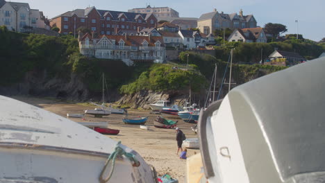 The-Harbour-Hotel-In-Newquay-Port-Hillside-Overlooks-Beach-and-Families,-Cornwall,-England---Slider-inwards-Shot