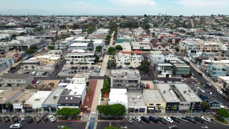 Manhattan-Beach-neighborhood-of-houses-and-businesses-establishing-aerial-flyover