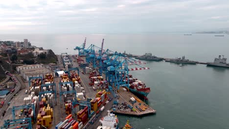 Aerial-view-Valparaiso-port-colorful-cargo-container-loading-docks-dolly-in-day