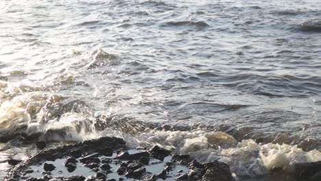 close-up-slow-motion-ocean-waves-tide-beach-barrier