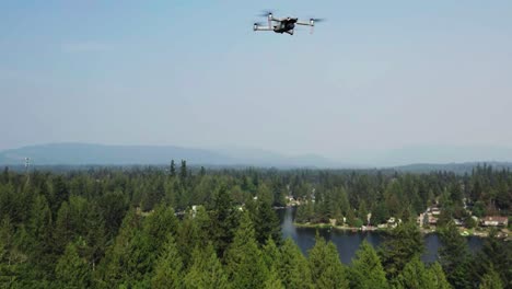 Drone-Flying-Above-Coniferous-Trees-At-Pipe-Lake-In-Covington,-Washington-State,-United-States