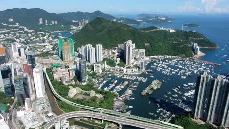 Aberdeen-harbour-and-skyline-in-southwest-Hong-Kong-island-on-a-beautiful-day,-Aerial-view