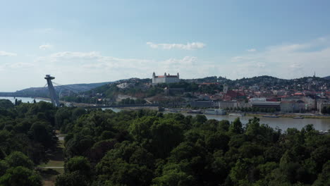 Wide-aerial-ascending-shot-of-Bratislava,-capital-of-Slovakia---summer-sunny-day