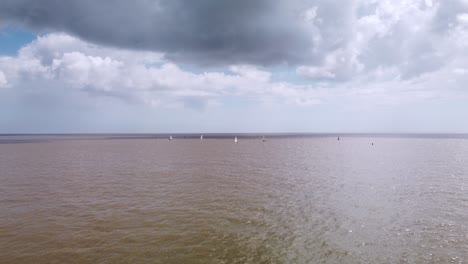 Aerial-Drone-Footage-Over-To-Small-Sailing-Yachts-Out-At-Sea