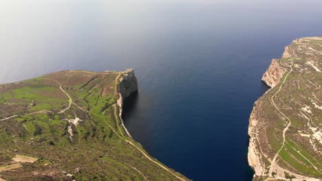 Magnificent-aerial-drone-video-from-the-Maltese-countryside,-Dingli-area,-Ras-id-Dawwara-bay-from-bird's-eye-view