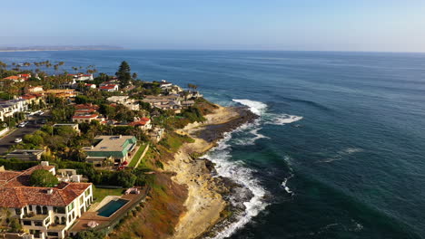 Aerial-flying-over-homes-by-the-coast-in-La-Jolla
