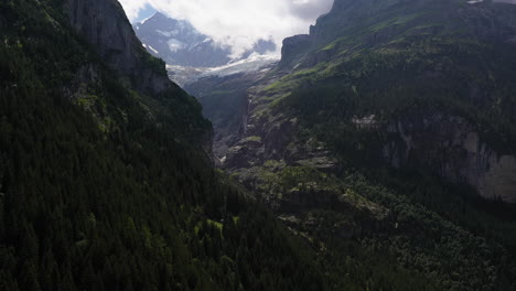 Rotating-cinematic-drone-shot-of-mountains-near-Grindelwald,-in-Switzerland’s-Bernese-Alps