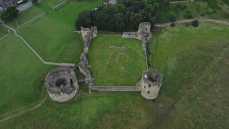 Flint-castle-Welsh-medieval-coastal-military-fortress-ruin-aerial-high-angle-right-rotate-view