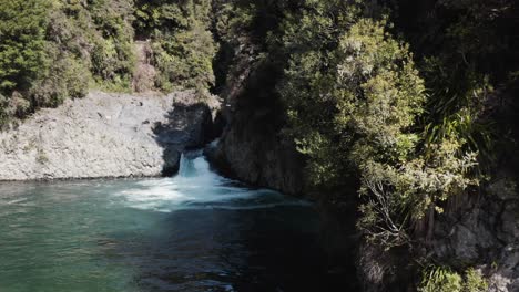 Idyllic-small-waterfall-on-Tongariro-river-in-natural-New-Zealand,-aerial