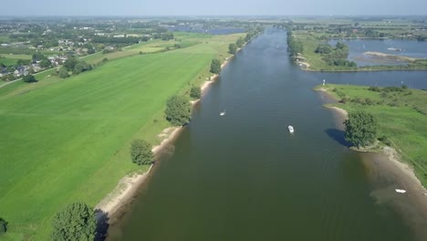 Aerial-drone-view-of-the-Meuse-river-that-runs-from-France,-Belgium,-and-the-Netherlands