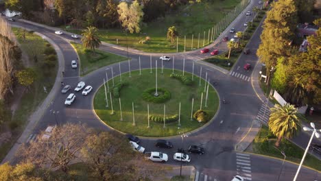 Aerial-view-of-roundabout-and-traffic-at-sunset-in-Tigre,-Argentina