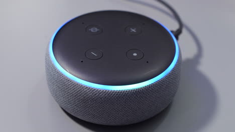 Smart-speaker-activated-by-voice-command-control-with-blue-light-ring
