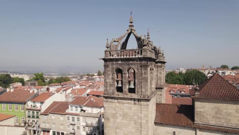Aerial-circling-around-bell-towers-on-top-of-Braga-Cathedral,-Portugal