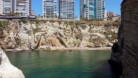 View-Of-The-Cliffs-In-Raouche-District-In-Beirut,-Lebanon---drone-shot