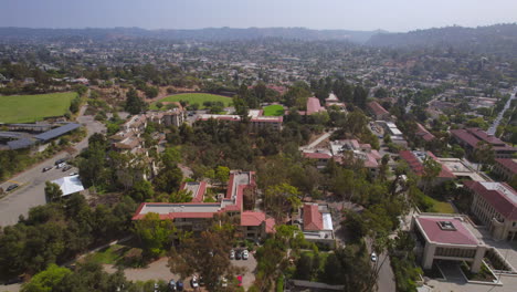 Pull-away-over-Occidental-college-campus-and-Eagle-Rock-neighborhood-in-Los-Angeles,-California-on-a-beautiful-and-clear-summer-day