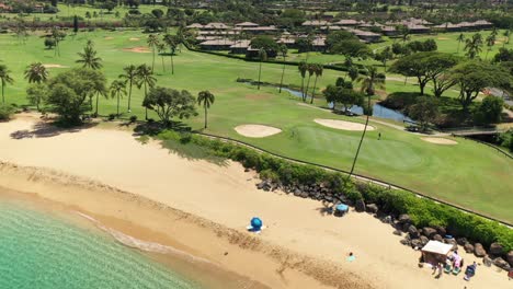Aerial-flyover-of-May's-beach-and-Kaanapali-golf-course-in-Maui,-Hawaii