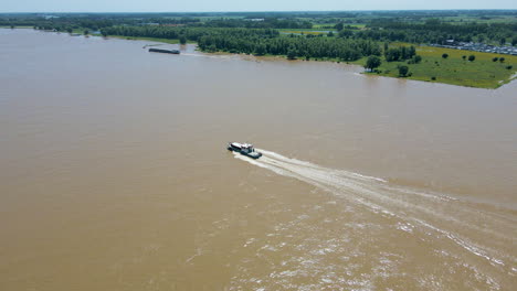 Aerial-of-motor-boat-moving-through-river