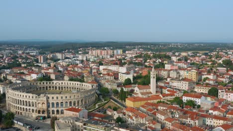 Aerial-panoramic-shot-of-the-big-colosseum-of-Pula