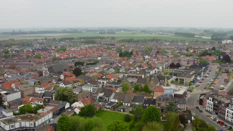 Aerial-fast-orbit-over-the-Axel-city-center-in-the-Netherlands-shot-on-a-cloudy-day