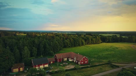 Landscape-Of-Red-Houses-On-Countryside-Outside-Hjo-In-Vastra-Gotaland-County,-Sweden