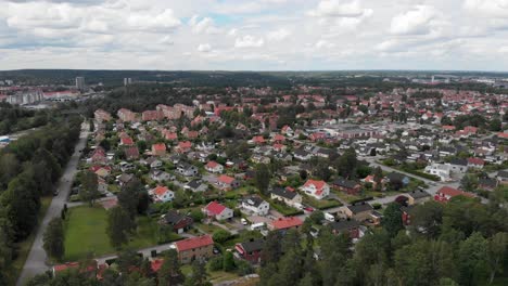AERIAL---Sandhem-villa-area-Trollhättan,-Sweden,-wide-shot-backwards