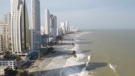 Aerial-Orbiting-Shot-Along-Cartagena-Coastline-on-Hot-Summer-Day