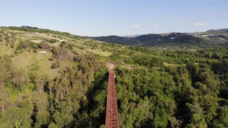 Drone-Pullback-Over-an-Old-Iron-Bridge-in-the-forest-mountain-view-4k-30fps