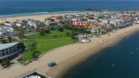 Aerial-view-of-Marina-park-and-Newport-Pier,-in-Newport-Beach,-California