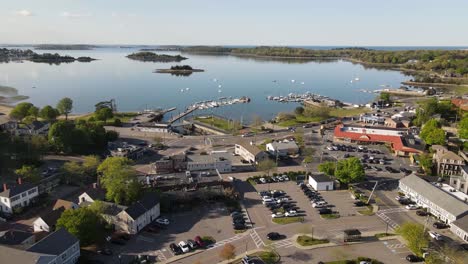 Rising-aerial-shot-of-a-harbor-with-docked-boats-at-dusk-in-Hingham