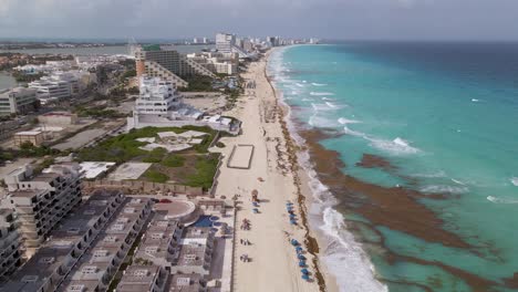 Cancun-luxury-hotels-on-beachfront,-tropical-seaside-hotels,-Mexico-4K-aerial