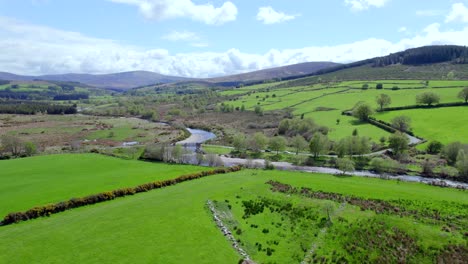 Aerial-view-of-Wicklow-fields,-pastures,-hills-in-sunny-weather