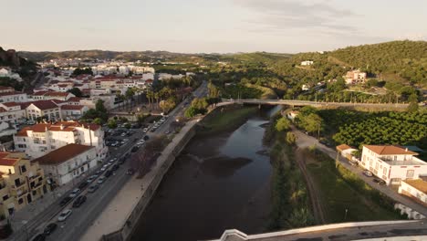 Aerial-shot-over-Arade-River-in-the-beautiful-historic-town-of-Silves,-Portugal