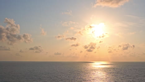 Drone-aerial-static-view-of-tropical-sun-shining-over-sea-water